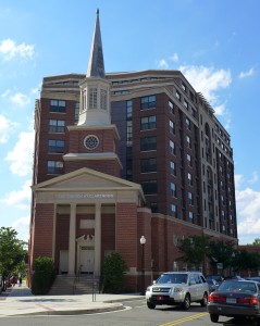 The preserved facade and steeple, along with the new mixed-use development.