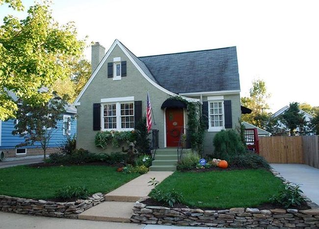 Located in Aurora Hills, this Sears house is notable for the sloping roof line, modest charm, and Dancing Bear in the front yard.